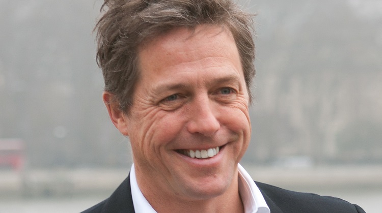 Hugh Grant Smiles At A Charity Photo Call In London